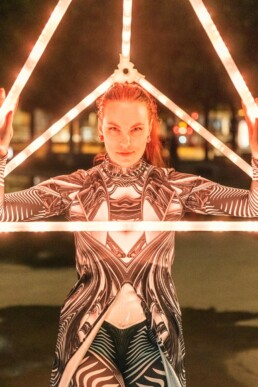 unnaturalglow-livewire-led-perfomer-glowing-pyramid-prop-act