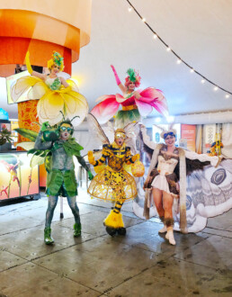 Ambient character event greeter interacting with guests during a live event performance