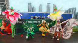 Ambient character event greeter interacting with guests during a live event performance