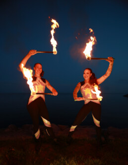 Fire performer in Toronto creating a dynamic live event performance with controlled flame effects