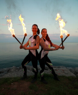 Fire performer in Toronto creating a dynamic live event performance with controlled flame effects